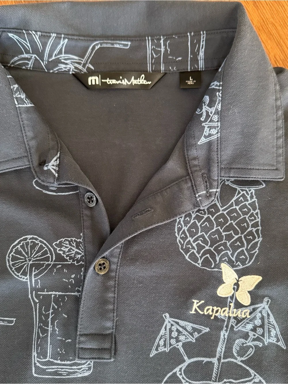 Travis Mathew Men's polo with Kapalua logo